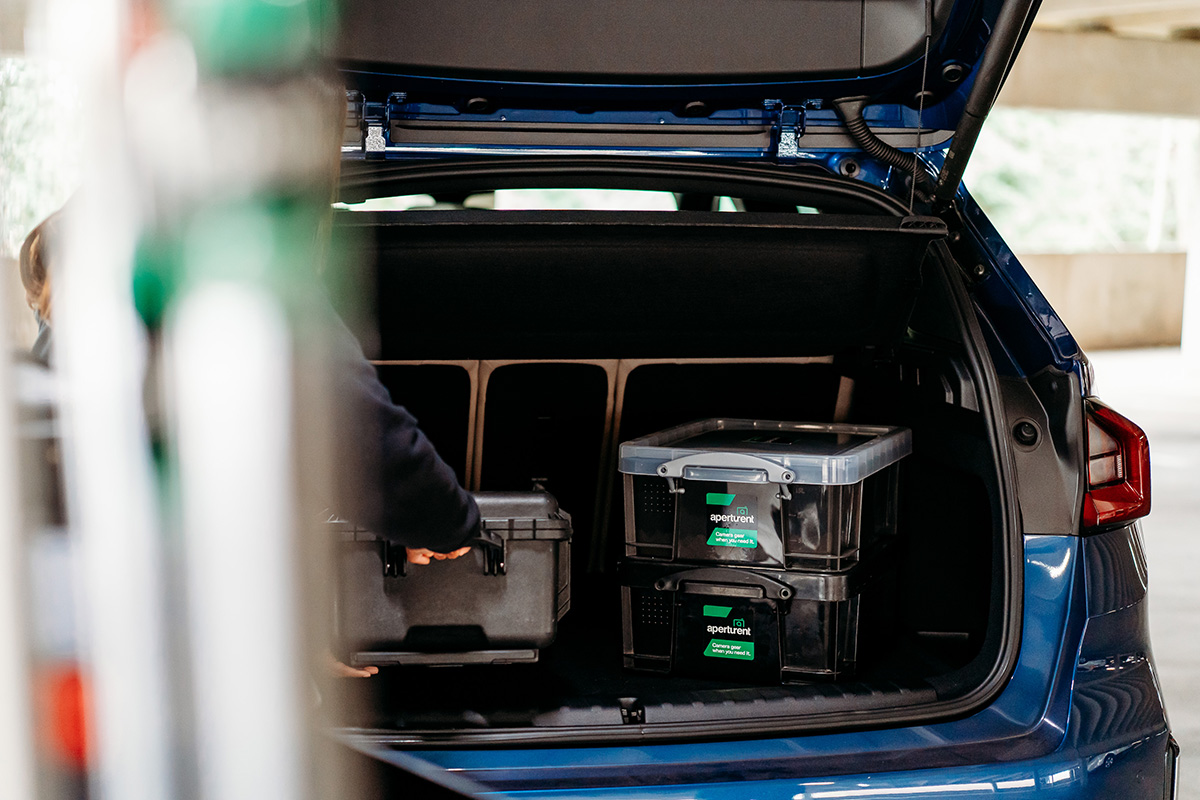 Customer loading rental cases into their car